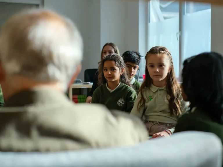 Mr. Grundy talking to students about the history of Perrott Hill and the importance of reading and books